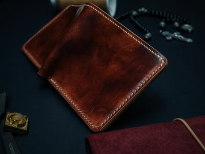 Museum Cognac shell cordovan bifold wallet — The Dillon, hand-stitched by Dark Sky Leather (side view)