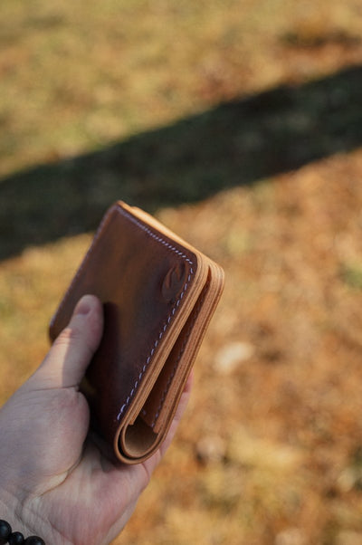 Shell cordovan and full grain leather vertical bifold — The Hosea by Dark Sky Leather (side view)